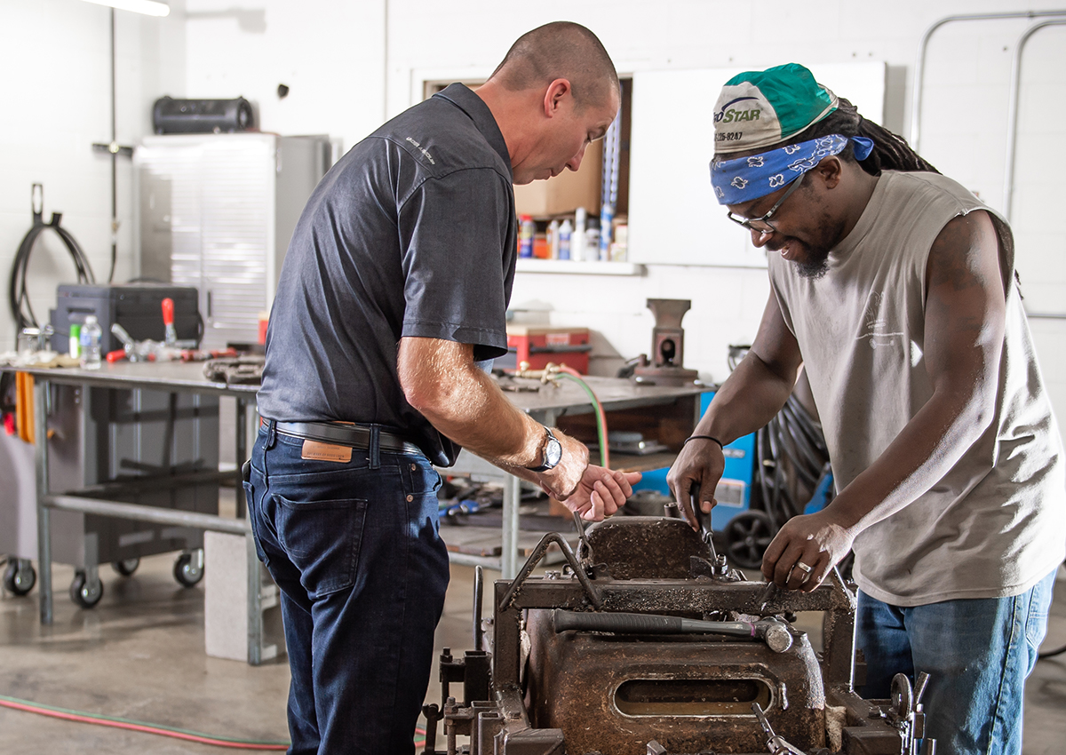 workers repairing a mold