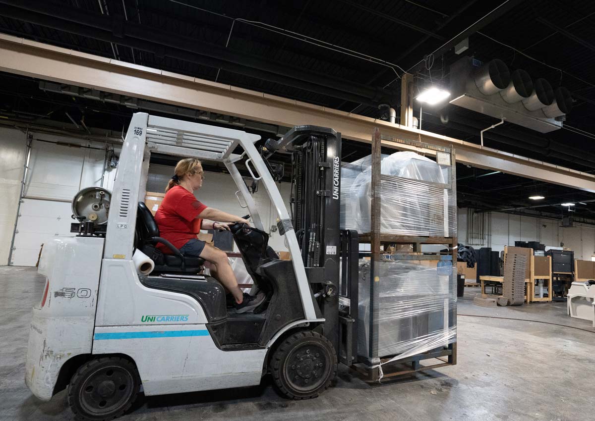 fork truck driver moving finished parts