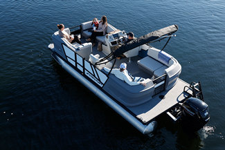 A pontoon boat that has many rotomolded parts like side panels, benches, chaise lounges, and helms.
